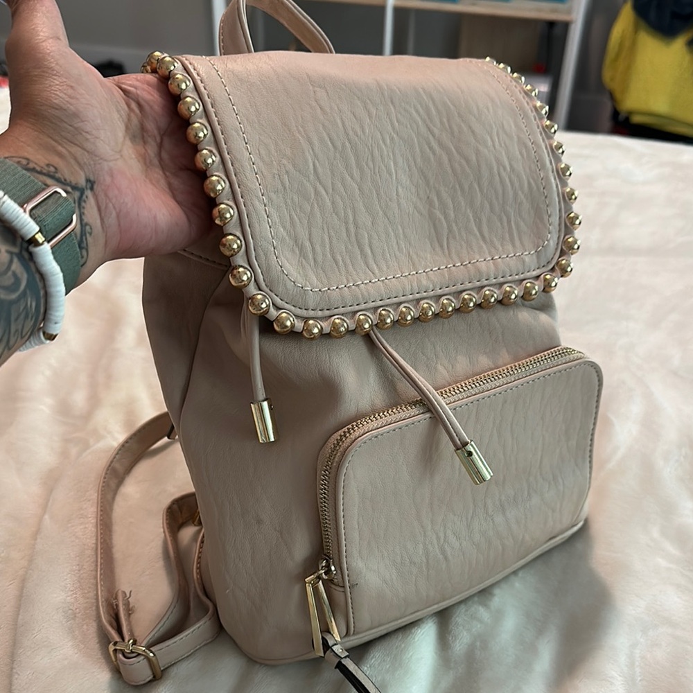 Jessica Simpson Elegant Cream Backpack with Gold Accents